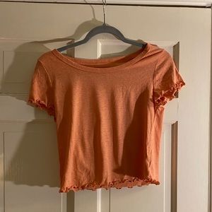 cropped salmon colored top